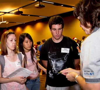 An industry representative talks to ASU freshman engineering students at Engineering Career Exploration Night. The event is designed to get first-year students thinking ahead about career planning as they embark on their college studies.