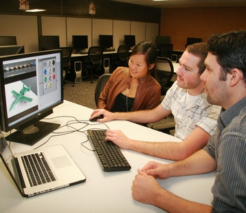 Checking out a computer-aided design software program at the new High Performance Computing Lab are (from left) Amanda Dong, a student who works with the student outreach retention program for the Ira A. Fulton Schools of Engineering, and Nick Becker and Wes Roberts, who work for Engineering Technical Services. Photo: Blaine Coury/ASU