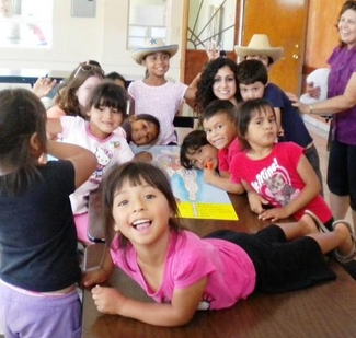 Tina Hakimi is pictured with children in an orphanage in Ensenada, Mexico, at the Camp H.O.P.E. project’s first summer camp designed to inspire disadvantaged youngsters to pursue education and careers.