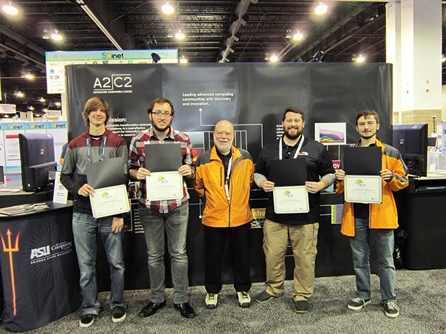 The ASU team won an award at the recent Supercomputing 2013 (SC13) Student Cluster Challenge. Pictured from left to right are team members Gabe Martin, Christian Ivaneok, mentor Charlie Collins, Clint Shuman and Ben Prather. 