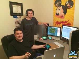 Ryan Christensen, seated, and his son, Collin, have worked together on independent gaming design.