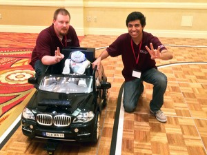 Joe Boeding, left, and Bijan Fakhri, members of the ASU team at the Cornell competition, pose with the robot they taught to drive a car.