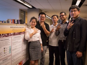Jingrui He and four of her graduate students in front of a research poster