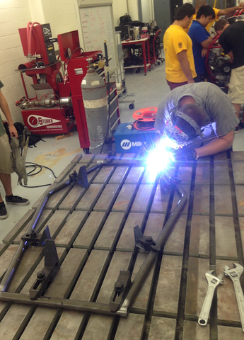 Sun Devil Racing club members gain valuable engineering experience by honing modeling, design, and manufacturing skills in their Baja car workshop. Photograph courtesy of Sun Devil Racing Development.