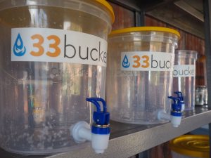 33 Buckets' filtration system uses a system of containers and swappable filters to meet each community's specific water needs.